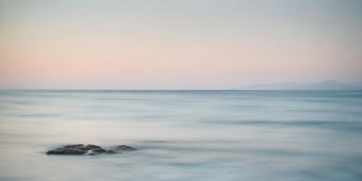 Long exposure of a calm pastel sea